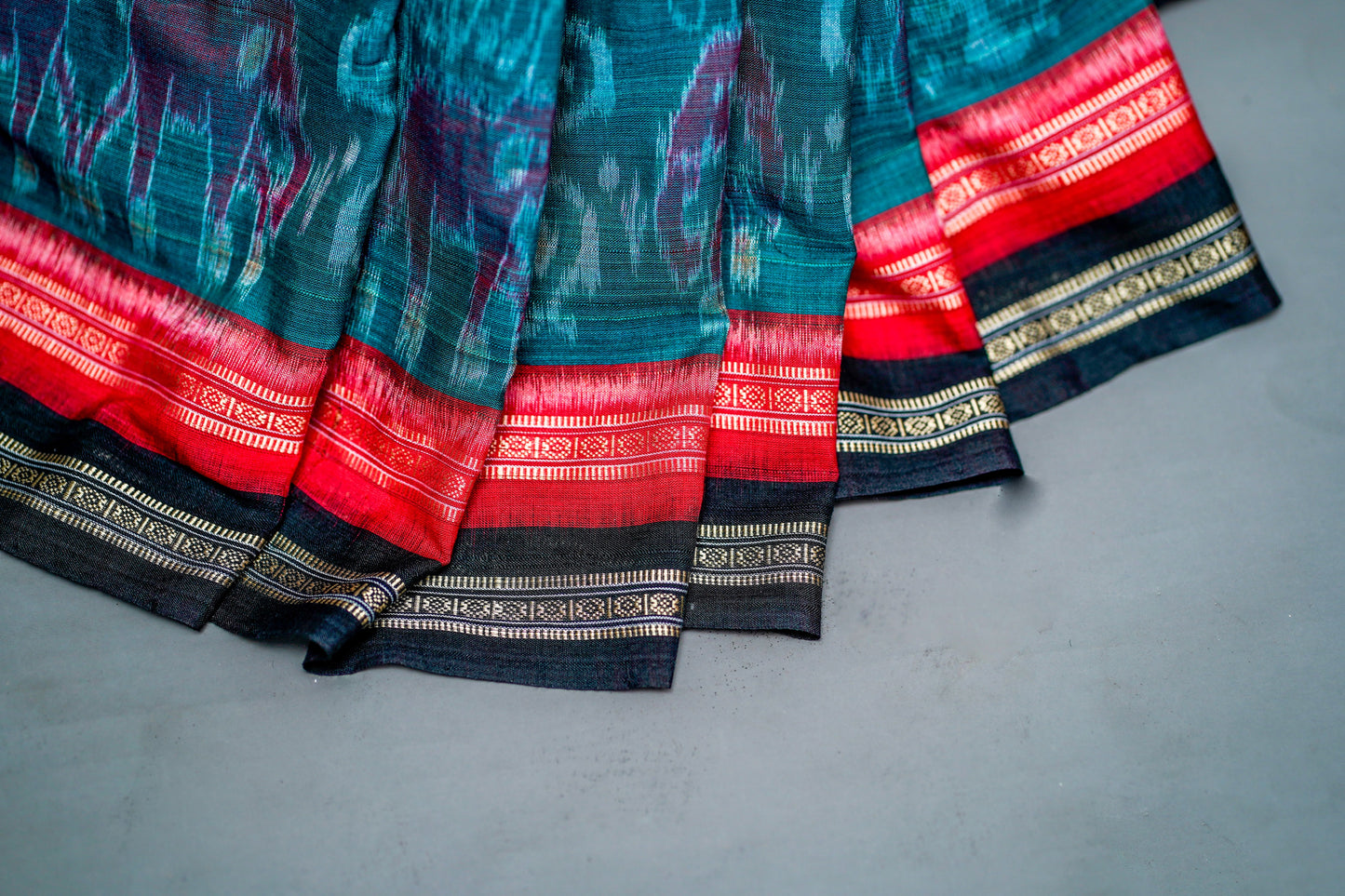 Sambalpuri Cotton( Deep Teal Green Base with Multi-Coloured Ikat Motifs)