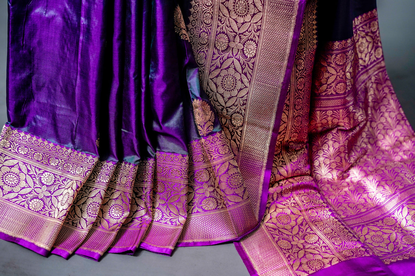 Katan Banarsi (Elegant blend of deep purple and black with golden zari detailing)