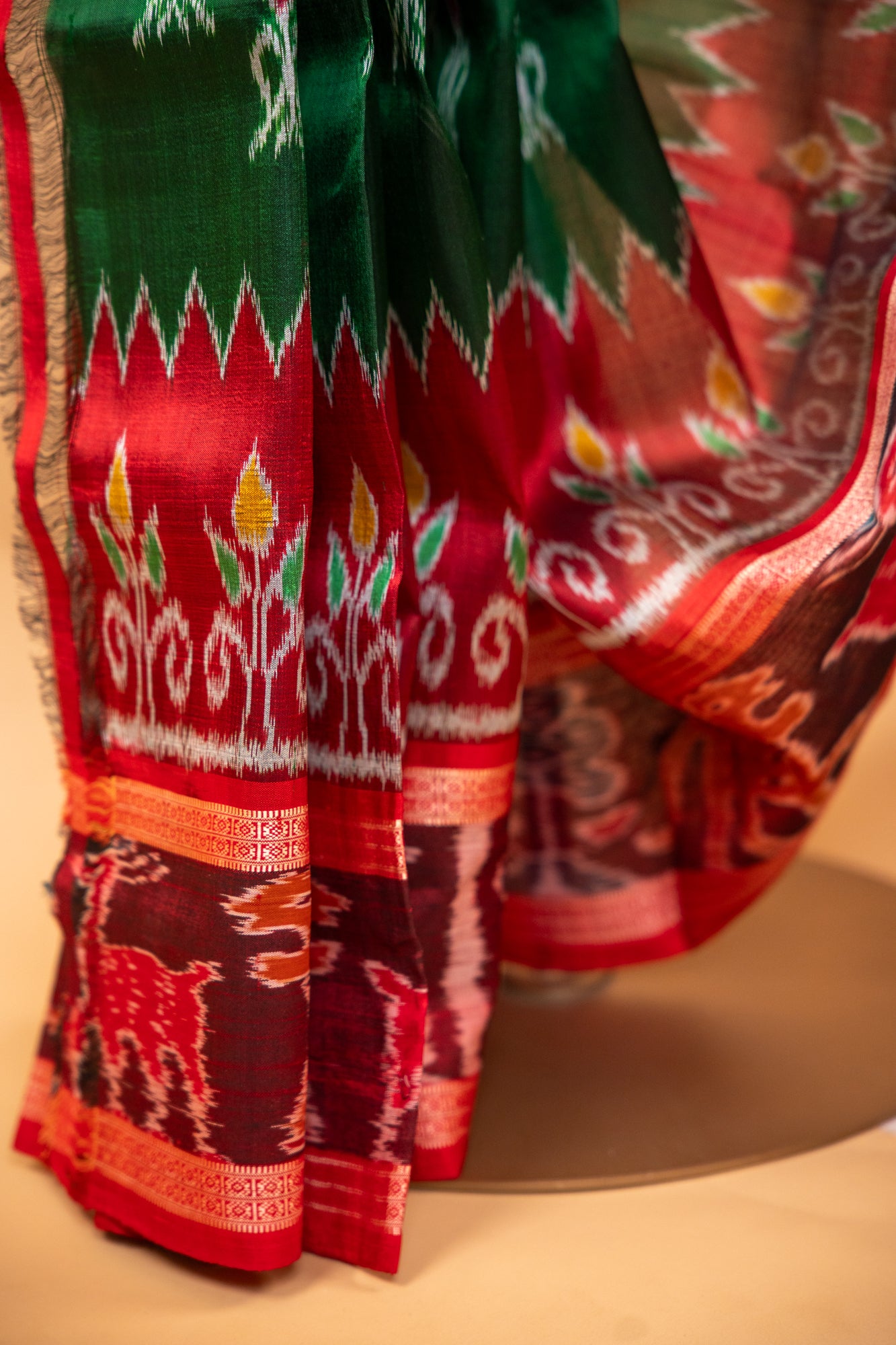Handwoven Emerald Green Khandua Silk Saree with Deer & Tiger Ikat Border