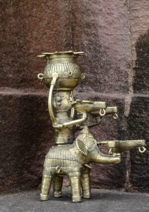 Dhokra lady with diya