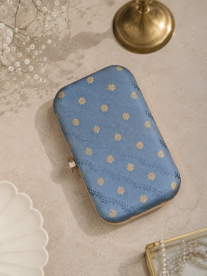 grey brocade clutch bag with gold detailing and chain strap for womens