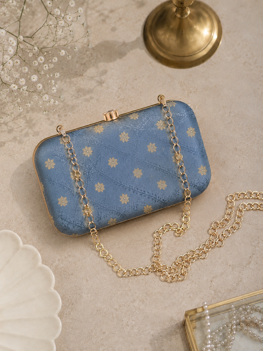 Slate grey brocade clutch bag with gold detailing and chain strap