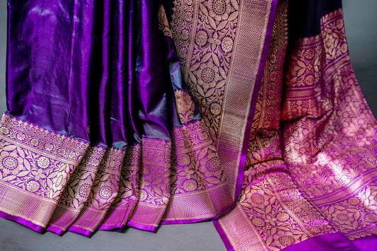 Katan Banarasi Saree (Elegant blend of deep purple and black with golden zari detailing) - Atulyakarigari