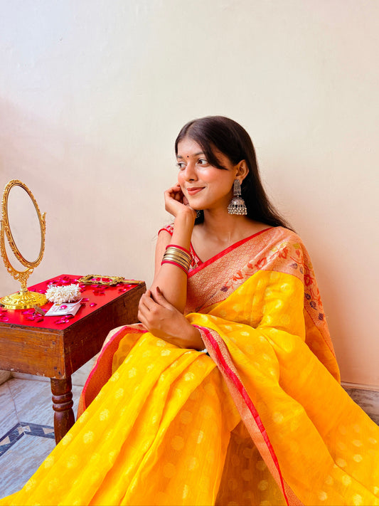 Basanti Yellow Banarsi Cotton Silk Saree –  Zari round floral motif with contrast border.
