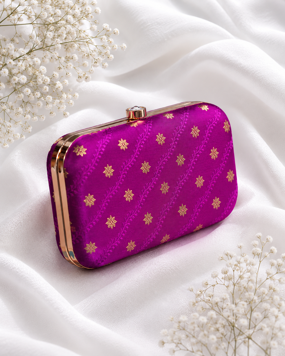 Magenta pink brocade clutch bag with floral butti patterns, detachable gold chain, and metallic frame for festive and wedding wear , for women