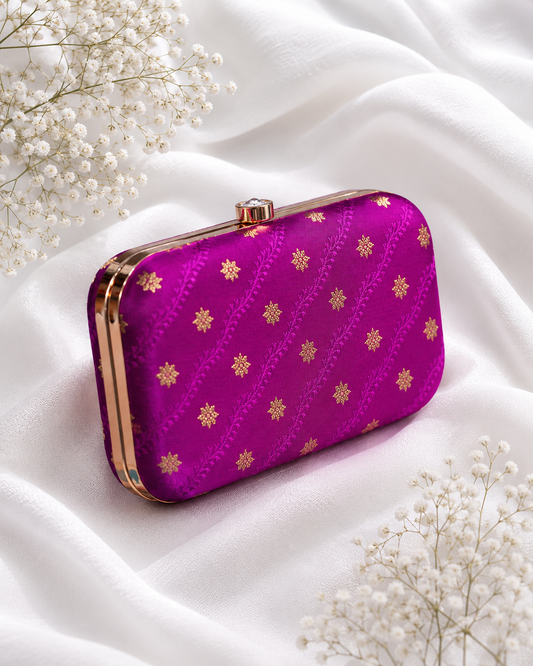 Magenta pink brocade clutch bag with floral butti patterns, detachable gold chain, and metallic frame for festive and wedding wear , for women