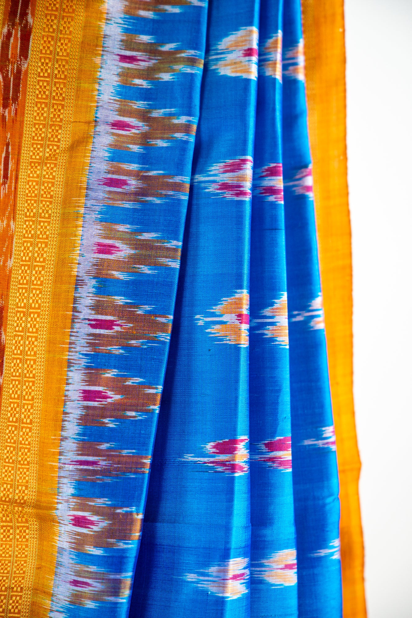 Luminous Blue,Mustard yellow/Bright Orange Khandua Silk Saree