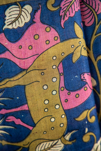 Royal Midnight Blue base adorned with Sage Green, Cream, and soft Coral Pink Pure Silk Saree