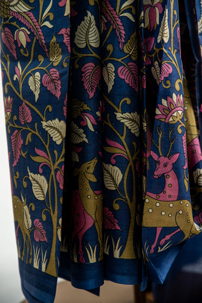 Royal Midnight Blue base adorned with Sage Green, Cream, and soft Coral Pink Pure Silk Saree