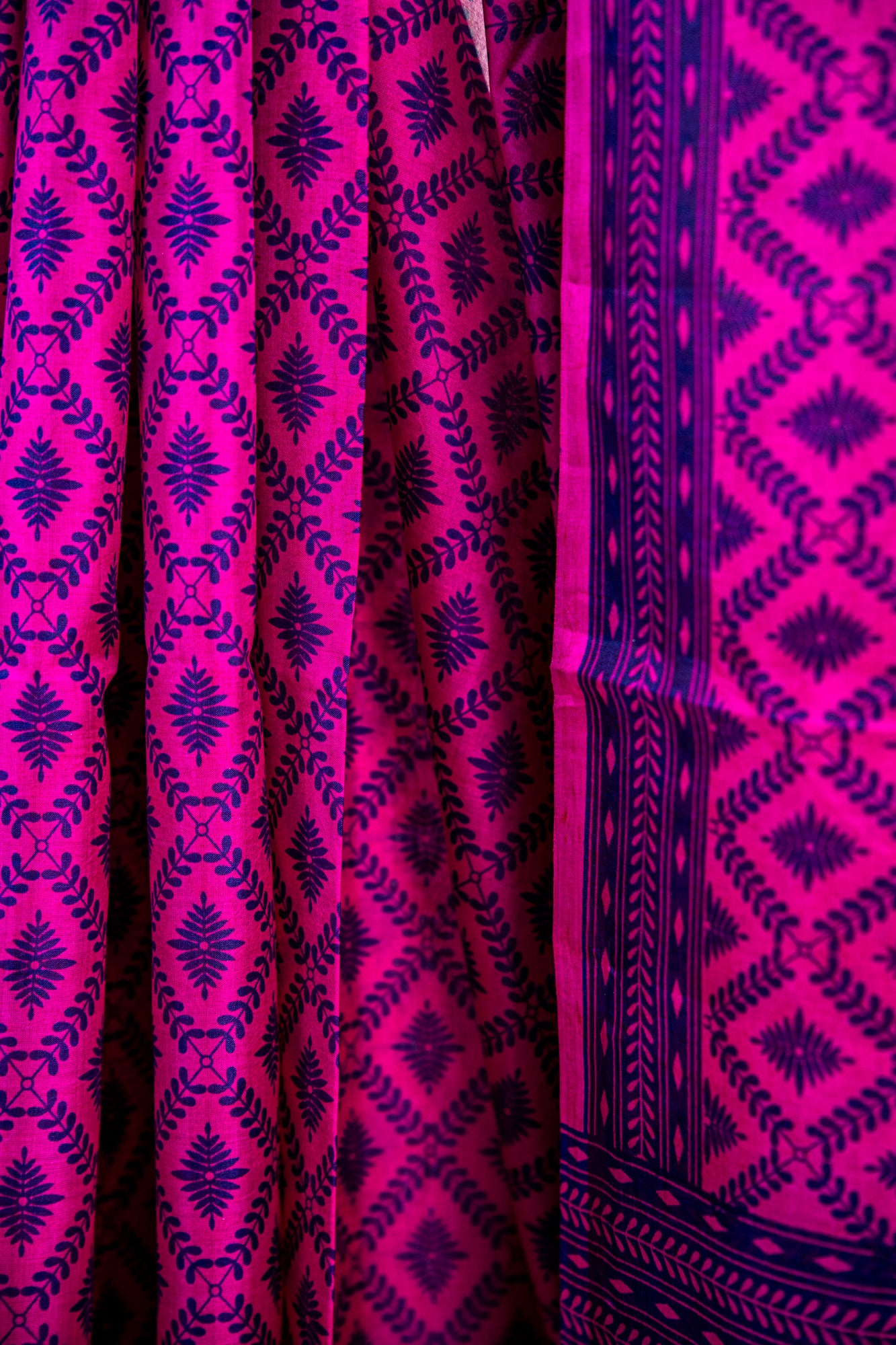 Vibrant Fuchsia Pink body with a deep Indigo Blue contrast print and border Pure Silk Saree