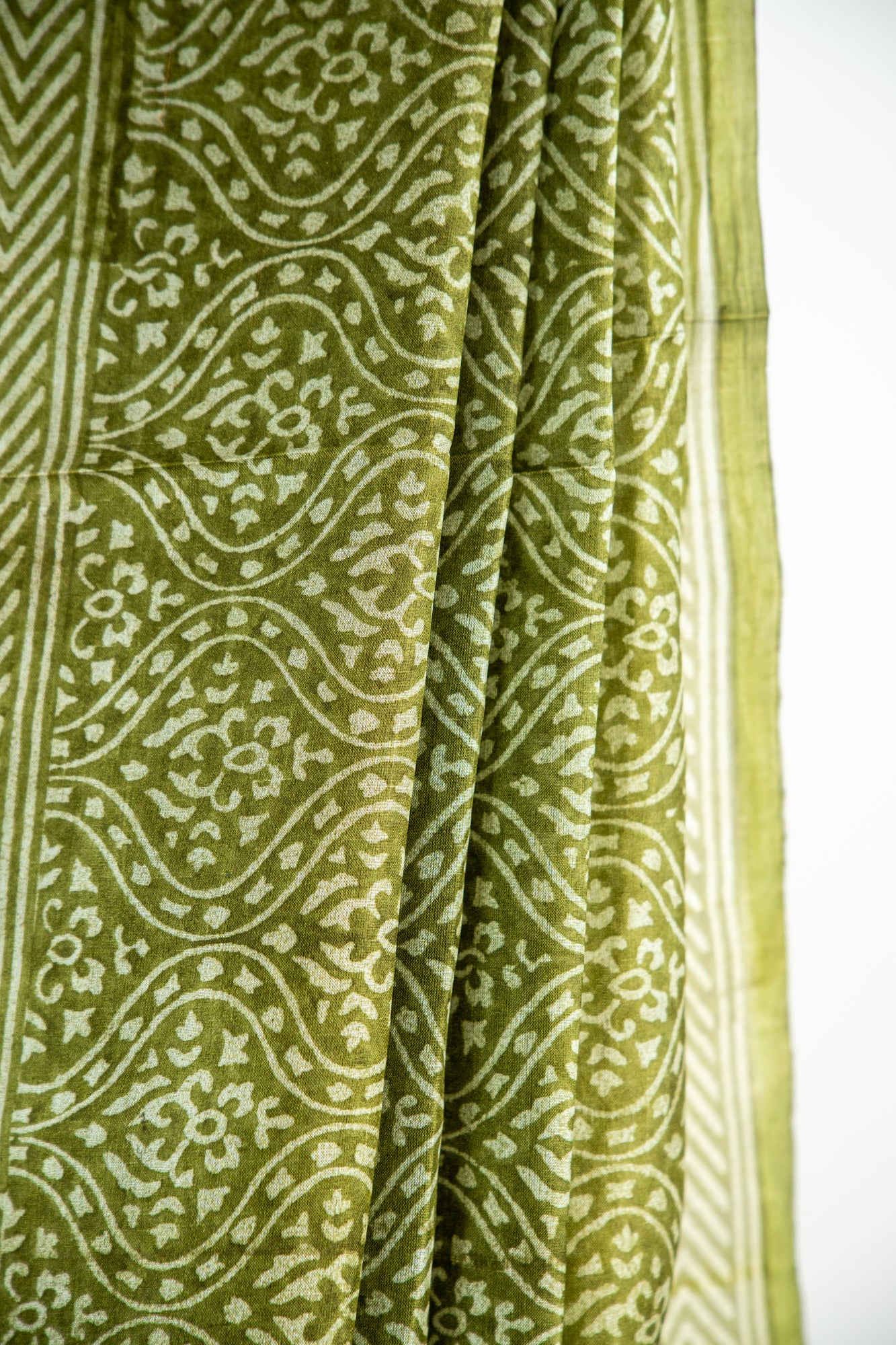 Mehendi Green / Rich Moss Green base with a soft cream contour Pure Silk Saree