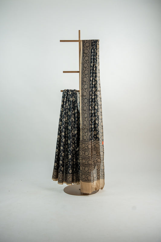 Charcoal Black base with a warm Ivory/Beige print Pure Silk Saree