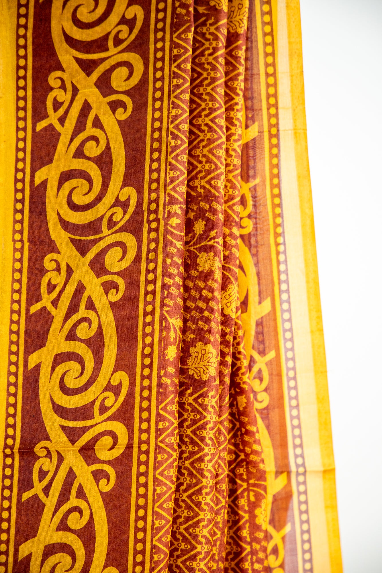 Mustard Yellow and Ochre Gold on a deep Rust-Brown base Pure Silk Saree