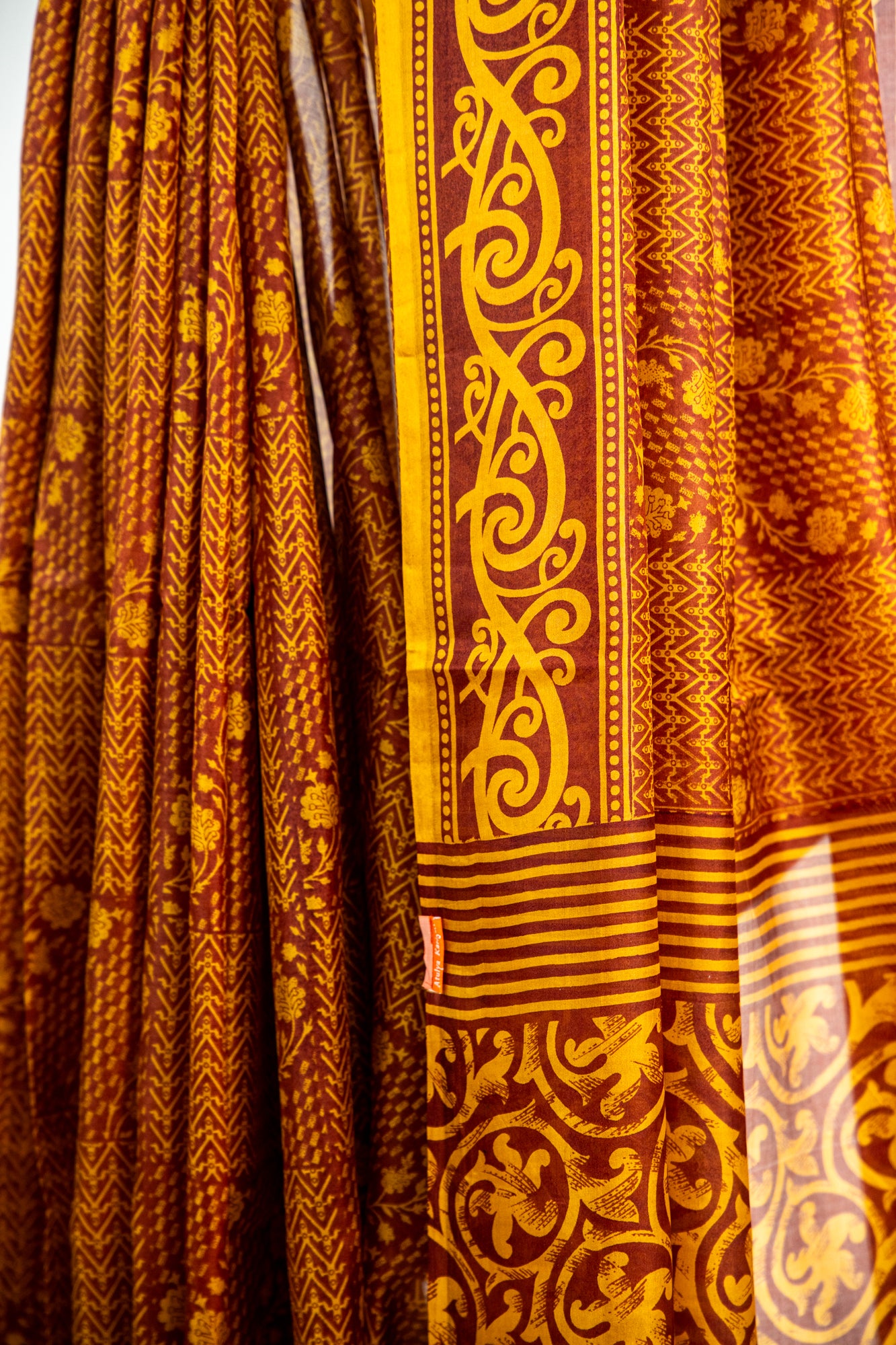 Mustard Yellow and Ochre Gold on a deep Rust-Brown base Pure Silk Saree
