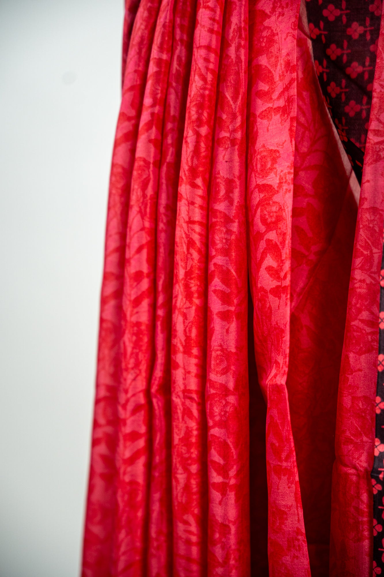 Crimson Red body with a solid Jet Black border Pure Silk Saree