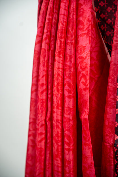 Crimson Red body with a solid Jet Black border Pure Silk Saree