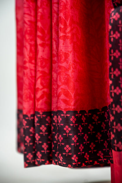Crimson Red body with a solid Jet Black border Pure Silk Saree