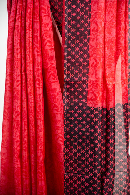 Crimson Red body with a solid Jet Black border Pure Silk Saree