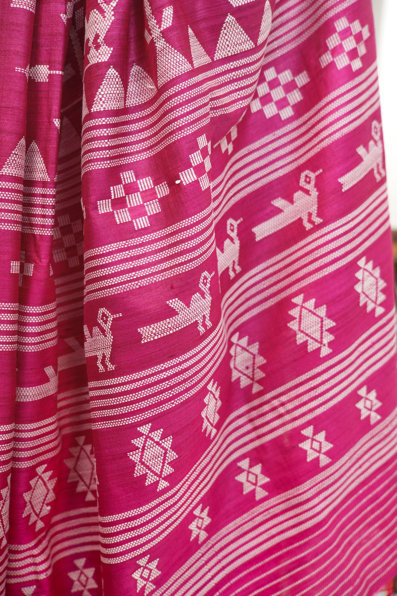 Magenta Tussar Silk Saree with White Ikat Motifs