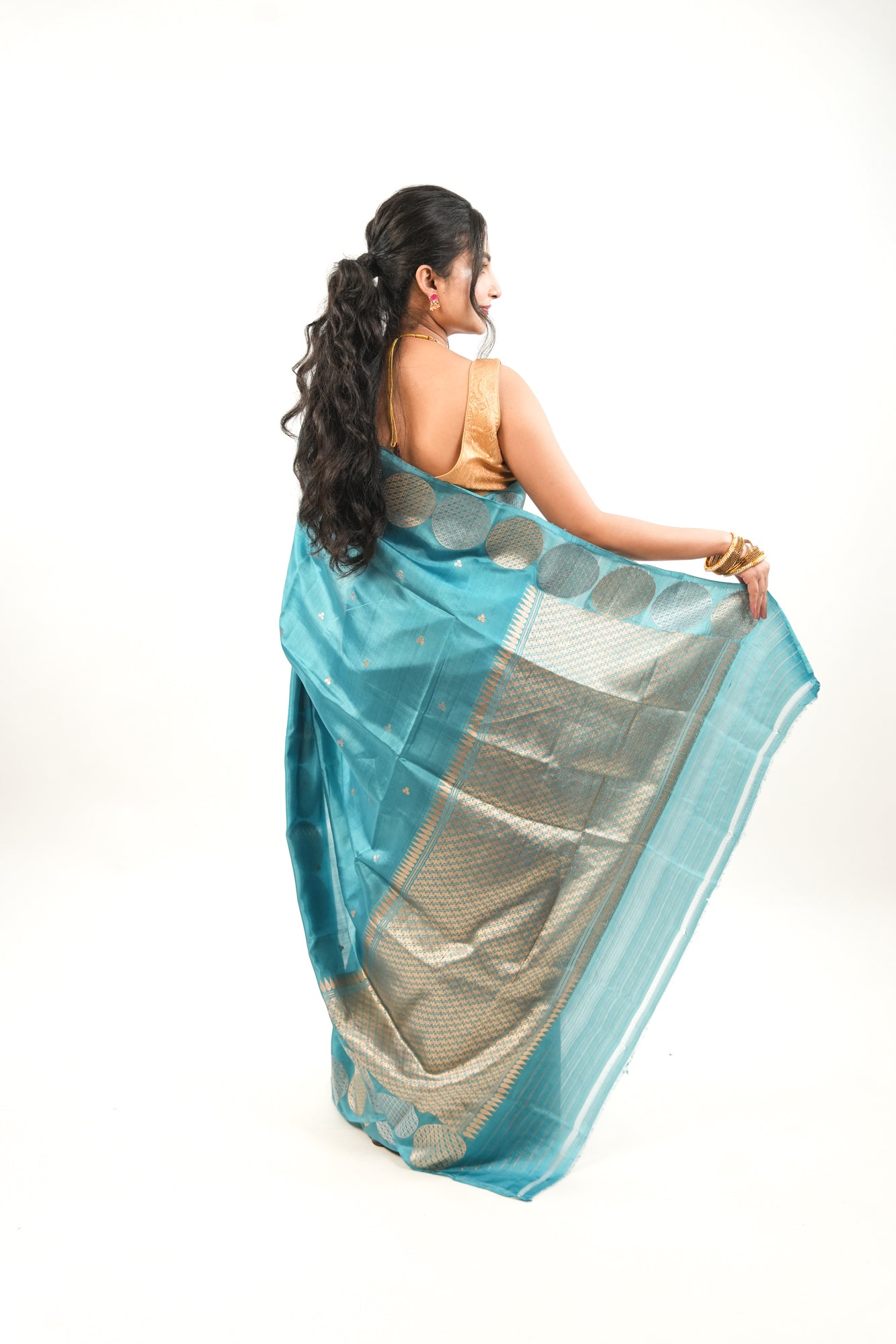 Peacock Teal Banarasi Silk Saree with Dual-Tone Chakra Border
