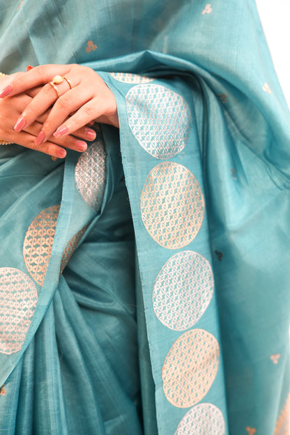 Peacock Teal Banarasi Silk Saree with Dual-Tone Chakra Border