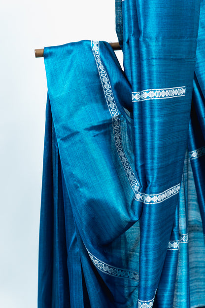 Teal Blue Tussar Silk Saree with White Geometric Border