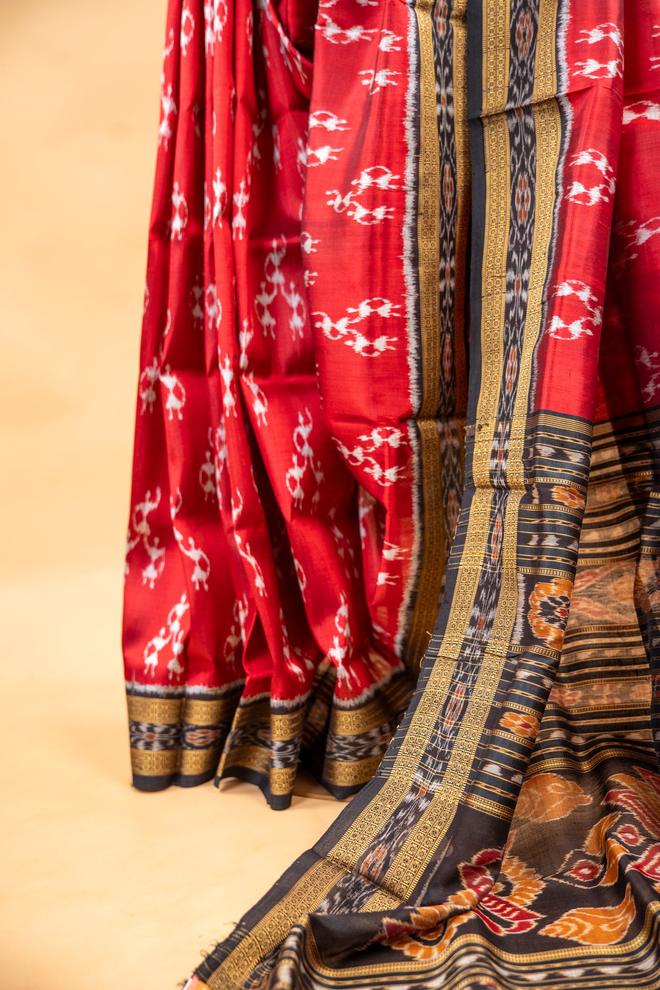 Handwoven Garnet Red Khandua Silk Saree with Tribal Saura Art Border