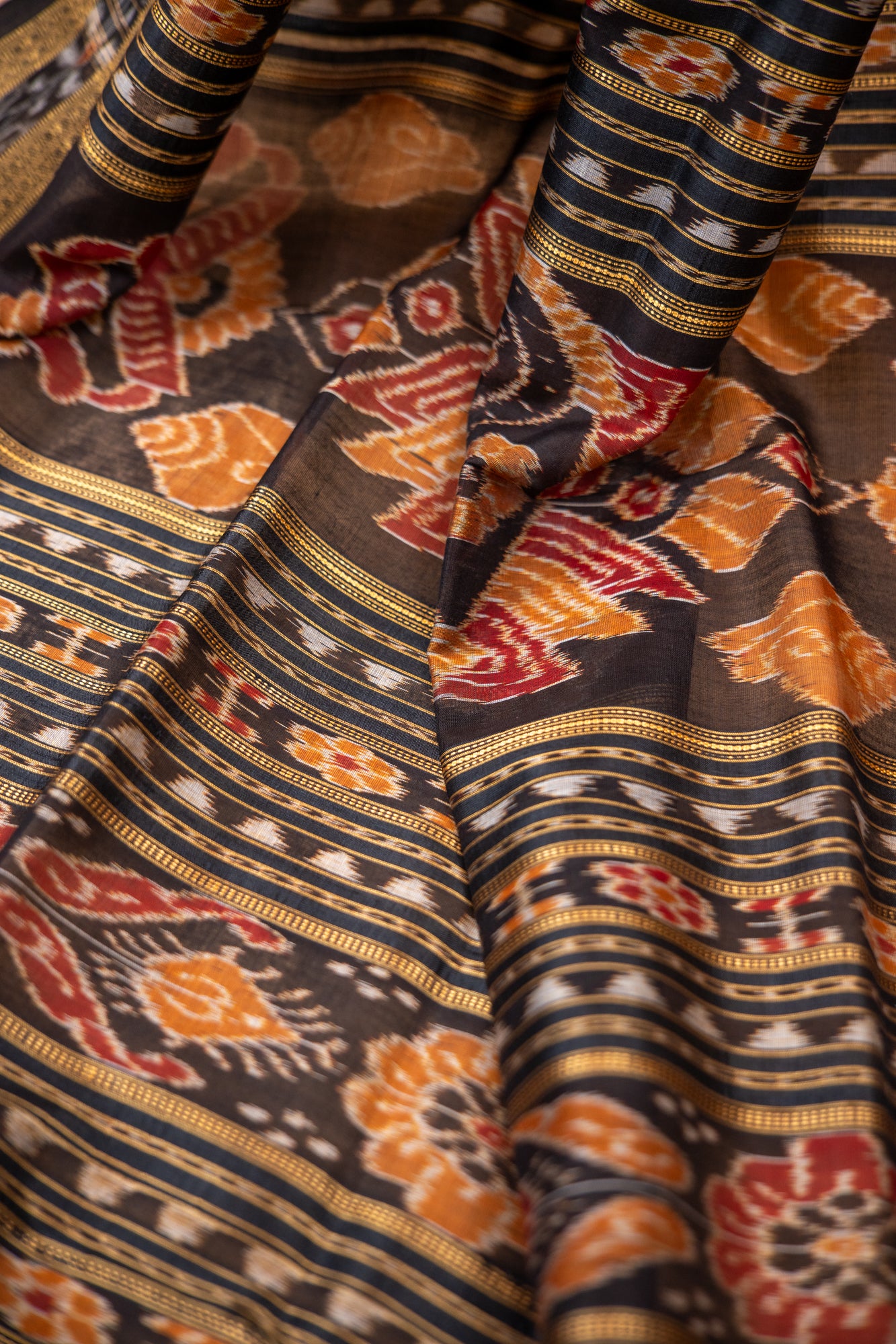 Handwoven Garnet Red Khandua Silk Saree with Tribal Saura Art Border