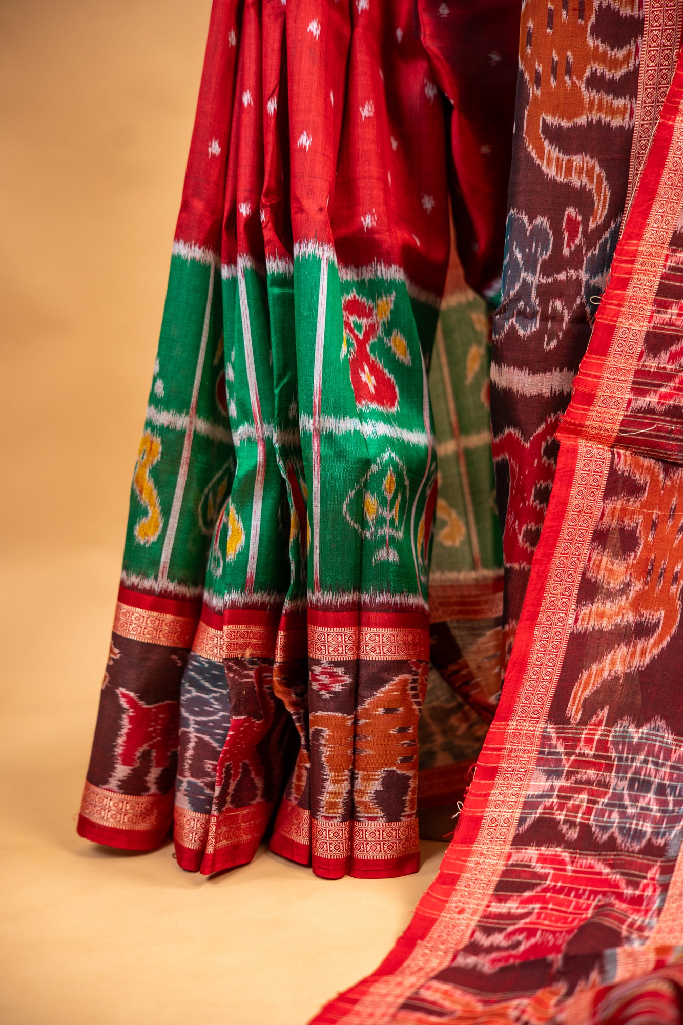 Ruby Red & Leaf Green Khandua Silk Saree with Animal Motif Border
